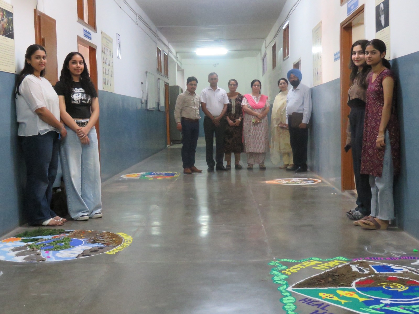 Faculty and students with the MICROBIO-themed rangoli — International Microorganism Day & Buttermilk Campaign (Oct 11, 2025).
